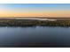 Expansive lake view surrounded by trees and residential development at 3130 Indian Trl, Eustis, FL 32726