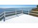 This pristine deck offers panoramic water views, providing an idyllic spot for relaxation and outdoor enjoyment at 3130 Indian Trl, Eustis, FL 32726