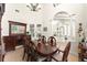 Dining room showcasing dark wood furniture, tile flooring, and arched doorway at 3130 Indian Trl, Eustis, FL 32726