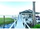 Private boat dock featuring covered seating and boat parking on the water at 3130 Indian Trl, Eustis, FL 32726