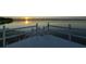 Wide angle view from the end of a wooden dock, offering gorgeous lake and sunset views at 3130 Indian Trl, Eustis, FL 32726