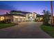 Spacious property features a long driveway, a three-car garage and beautiful manicured landscaping at 3130 Indian Trl, Eustis, FL 32726