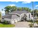 Expansive waterfront property with grand curb appeal and an attached three-car garage at 3130 Indian Trl, Eustis, FL 32726