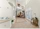 Bright foyer with tile flooring, a staircase, and a view into the living area at 3130 Indian Trl, Eustis, FL 32726