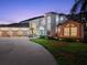Exterior of house featuring circular driveway and spacious three car garage at 3130 Indian Trl, Eustis, FL 32726