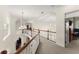 Upstairs hallway showcasing architectural details and multiple light fixtures at 3130 Indian Trl, Eustis, FL 32726