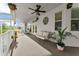The covered lanai features comfortable seating and beautiful views at 3130 Indian Trl, Eustis, FL 32726