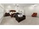 Large bedroom with wood furniture, a seating area, and access to an outdoor balcony at 3130 Indian Trl, Eustis, FL 32726