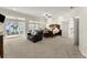 The main bedroom features a king bed, a sitting area, and access to the lanai at 3130 Indian Trl, Eustis, FL 32726