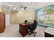 Comfortable office with a large desk, ergonomic chair, and a large window for natural light at 3130 Indian Trl, Eustis, FL 32726