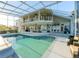 The enclosed pool area features a large pool, multiple seating areas, and access to the lake at 3130 Indian Trl, Eustis, FL 32726