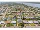 An aerial shot features the property's location within a picturesque neighborhood and lake at 324 Plaza Blvd, Daytona Beach, FL 32118