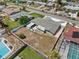 An aerial view of a home with a spacious fenced backyard and outdoor patio space at 324 Plaza Blvd, Daytona Beach, FL 32118