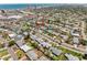 An aerial shot showcases the home's location within a community near the ocean at 324 Plaza Blvd, Daytona Beach, FL 32118