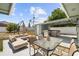 A Backyard patio including outdoor seating, a hot tub, grill, and dining table at 324 Plaza Blvd, Daytona Beach, FL 32118