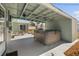 Backyard with hot tub and covered patio perfect for outdoor living and entertaining at 324 Plaza Blvd, Daytona Beach, FL 32118