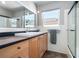 Bright bathroom features a large mirror, ample counter space, and a window providing natural light at 324 Plaza Blvd, Daytona Beach, FL 32118