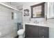Updated bathroom featuring walk-in shower, marble vanity, and tiled walls at 324 Plaza Blvd, Daytona Beach, FL 32118