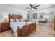 Bright bedroom featuring natural wood furnishings, sliding closet, and tile floors at 324 Plaza Blvd, Daytona Beach, FL 32118