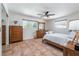 Comfortable bedroom with plenty of natural light, ceiling fan, and wood furnishings at 324 Plaza Blvd, Daytona Beach, FL 32118