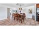 Bright dining area with neutral walls, light fixture, tile floors, and view to a patio at 324 Plaza Blvd, Daytona Beach, FL 32118