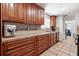 Functional kitchen with ample cabinet space, tiled countertops, and modern appliances for effortless meal preparation at 324 Plaza Blvd, Daytona Beach, FL 32118