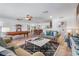 Inviting living room featuring comfortable seating, a pool table, and an open layout, perfect for gatherings and relaxation at 324 Plaza Blvd, Daytona Beach, FL 32118