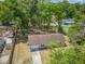Aerial view of home, showcasing the lush greenery and a long private driveway at 330 Ponce Deleon Blvd, De Leon Springs, FL 32130