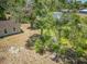 Aerial view of a home's exterior with mature trees and partial view of the backyard at 330 Ponce Deleon Blvd, De Leon Springs, FL 32130