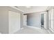 Spacious bedroom with neutral carpet, a ceiling fan, and ample closet space at 330 Ponce Deleon Blvd, De Leon Springs, FL 32130