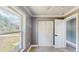 Bright bedroom with carpet, window, closet with folding doors, and gray walls at 330 Ponce Deleon Blvd, De Leon Springs, FL 32130