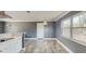 Modern kitchen with white cabinets, stainless steel hood, and breakfast bar seating at 330 Ponce Deleon Blvd, De Leon Springs, FL 32130