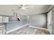 Open-concept living space with marble-look flooring and neutral gray walls at 330 Ponce Deleon Blvd, De Leon Springs, FL 32130