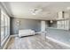 Stylish living area showcasing marble-look floors, modern decor, and abundant natural light at 330 Ponce Deleon Blvd, De Leon Springs, FL 32130