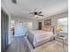 Comfortable bedroom with ceiling fan, natural light, and modern finishes at 330 Wall Ave, Ormond Beach, FL 32174