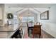 Bright dining area with vaulted ceiling and view of the landscaped outdoors at 330 Wall Ave, Ormond Beach, FL 32174