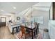 Charming dining area with vaulted ceilings, ample natural light, and adjacent kitchen at 330 Wall Ave, Ormond Beach, FL 32174