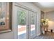 Double doors lead from the living room to the outdoor patio with backyard view at 330 Wall Ave, Ormond Beach, FL 32174