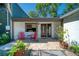 Charming porch with chairs and a plant at 330 Wall Ave, Ormond Beach, FL 32174