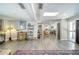 Bright living room featuring hardwood floors that connect to a modern kitchen at 330 Wall Ave, Ormond Beach, FL 32174