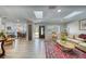 Cozy living room with hardwood floors, a large rug, and lots of sunlight at 330 Wall Ave, Ormond Beach, FL 32174