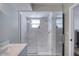 Modern bathroom shower features glass doors and stylish textured tile at 330 Wall Ave, Ormond Beach, FL 32174