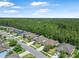 Neighborhood aerial view showcasing well-maintained homes backing to a lush green space at 43 Pergola Pl, Ormond Beach, FL 32174