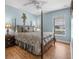 Inviting bedroom with a traditional four-poster bed, complemented by decorative bedside lamps and refined wall accents at 43 Pergola Pl, Ormond Beach, FL 32174