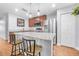 Well-equipped kitchen with stainless steel appliances, granite countertops, and stylish island at 43 Pergola Pl, Ormond Beach, FL 32174