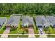 Aerial view of a single-Gathering home featuring a well-manicured lawn and a brick-paved driveway at 5635 Estero Loop, Port Orange, FL 32128