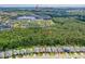 Aerial view of a residential community with a lake, conservation area, and easy access to I-95 at 5635 Estero Loop, Port Orange, FL 32128