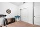 Spacious bedroom featuring a ceiling fan, a chest, a beverage cooler, and a closet with sliding doors at 5635 Estero Loop, Port Orange, FL 32128