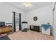 Spacious bedroom featuring a ceiling fan and a treadmill, plus a chest, a dresser, and a beverage cooler at 5635 Estero Loop, Port Orange, FL 32128