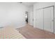 Bright bedroom with a patterned bed, a plush carpet, and a closet with sliding doors at 5635 Estero Loop, Port Orange, FL 32128